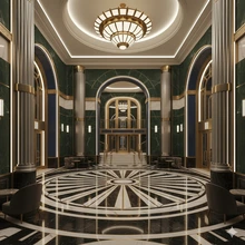 A symmetrical, wide-shot photograph of a grand Art Deco lobby.